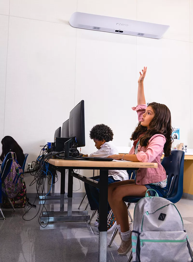 girl in school with r zero beam sanitizing air