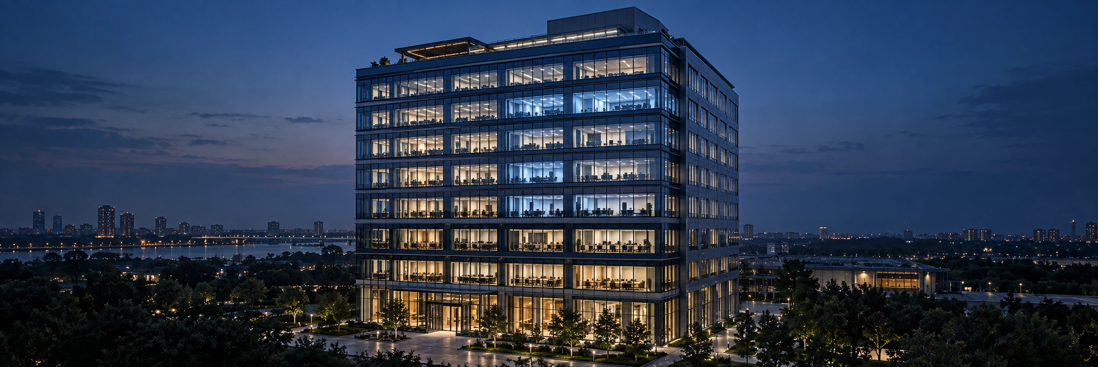Multi-story commercial office building at dusk